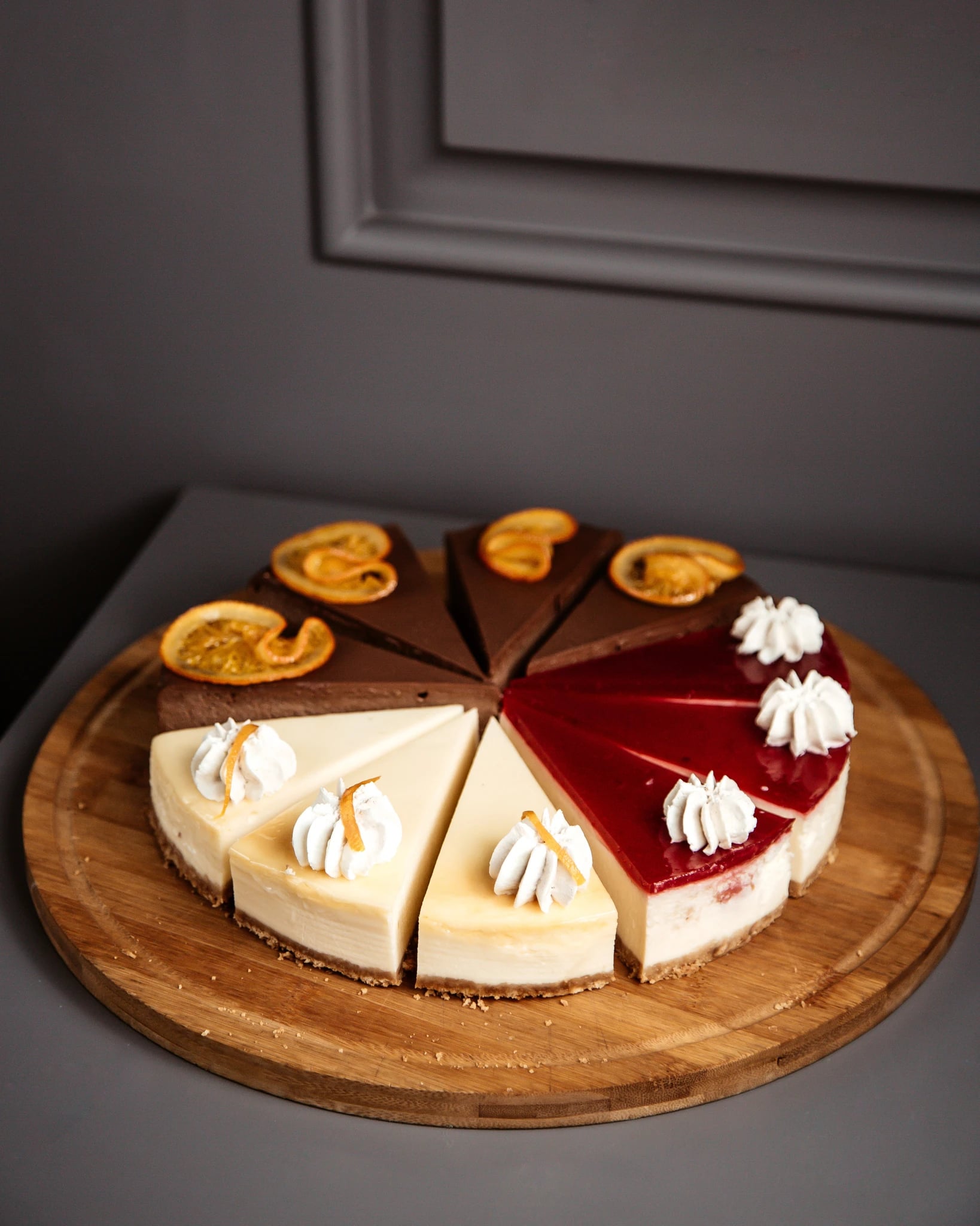 Sliced cheesecake on a wooden plate